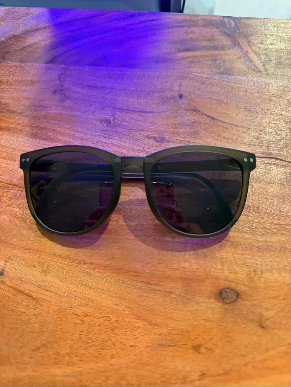 Green sunglasses with black lenses